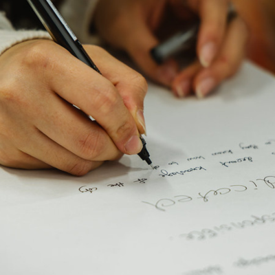 Image of a person writing.