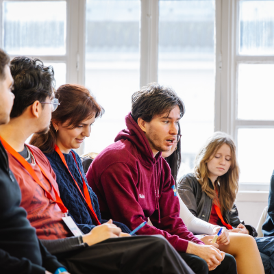 Image of a group of students in a conference.