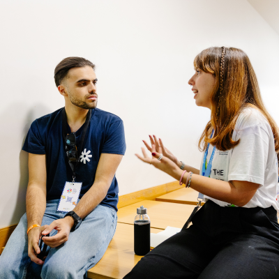 Image of a two students talking.